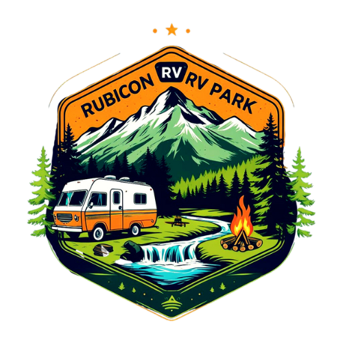 Badge-style logo showing a scenic RV park with a camper, campfire, picnic table, tall pine trees, a stream, and mountains in the background. Text reads “RUBICON RV PARK” at the top.